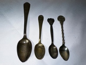 lot 552 image: Four Silver Plated Spoons - One Century of Progress 1933 Chicago Administration Building, 1893 Worlds Fair Commemorative Spoon, and 1969 Moon Landing Spoon