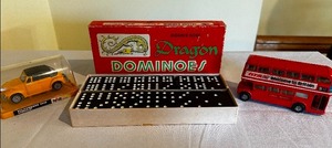 lot 362 image: Yellow Volkswagen 1300 cabriolet model car in case, double nine dragon dominoes vintage game, and welcome to Britain double-decker bus model car