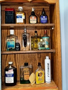 lot 117 image: Antique Bathroom Tonics and Aftershaves in Vintage Bottles.