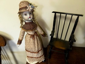 lot 422 image: Porcelain Girl Doll with Stand and Rocking Chair with Beanie Baby Flamingo (Tag Attached).
