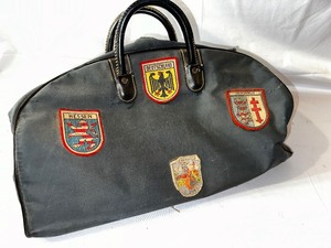 lot 515 image: Vintage Duffel Bag with Patches.