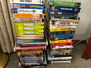 lot 37 image: Large Variety of Older VHS Tapes and DVDs.
