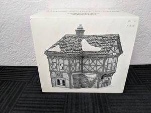 lot 113 image: Dept. 56 Heritage Village Collection Dickens Village T. Puddlewick Spectacle Shop