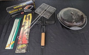 lot 73 image: Variety of Skewers, BBQ Grill Baskets, Lodge Cast Iron Pot with Lid