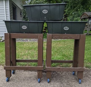 lot 16 image: (3) EarthBox Container Gardening Systems and (2) Wood Stands on Wheels