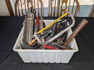 lot 55 image: Assortment of Tools in Bin Saw, Caulk Gun, Screwdrivers, Hammers, Axe, Trowels, and More
