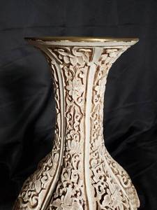 lot 11 image: Intricately Carved Ceramic Vase with Floral Design