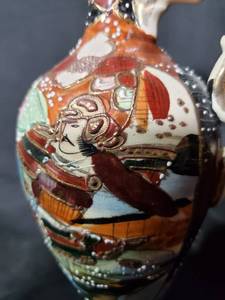 lot 34 image: Vintage Hand-Painted Porcelain Vase with Samurai Design