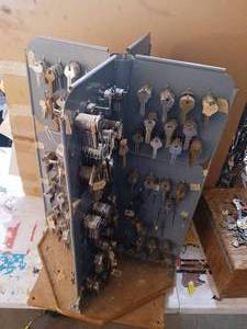 lot 15 image: 4 sided spinning key display full of NOS key blanks