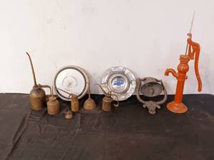 lot 84 image: Vintage hubcaps, oil cans, Bell, miniature pump