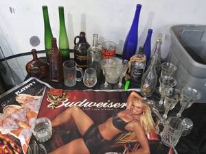 lot 97 image: Budweiser poster and assorted barware