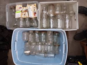 lot 94 image: Large assortment of Ball and Kerr jars with some new lids and rings