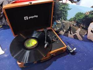 lot 96 image: Popsky portable record player with the Beatles Abby Road record works great