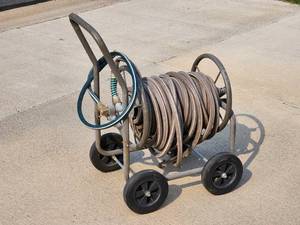 lot 54 image: Garden Hose with Rolling Caddie