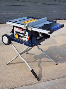 lot 15 image: Ryobi 10 in. Portable Contractors Table Saw with Rolling Stand