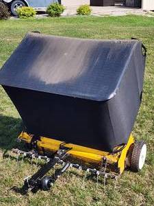 lot 20 image: Yard Works Pull behind ATV  Riding Lawn Mower 42 in. Lawn Sweeper with Grass Thatcher Attachment