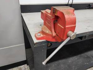 lot 52 image: Homemade Garage Black Workbench with Power Strips and Bench Vise