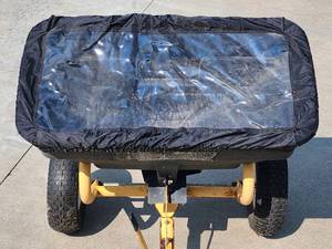 lot 112 image: Yard works Pull Behind ATV  Riding Lawn Mower Fertilizer Spreader
