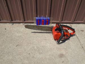 lot 103 image: Homelite 14 chainsaw. Tested & runs. Good used condition. As shown.