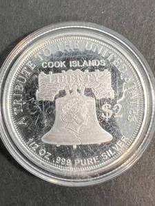 lot 39 image:  TROY OZ .999 FINE SILVER COOKS ISLAND ROUND IN AIRTITE