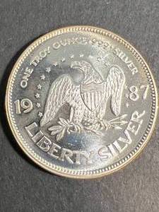 lot 53 image: 1 TROY OZ .999 FINE SILVER A-MARK LIBERTY ROUND