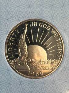 lot 77 image: 1986-S US STATUE OF LIBERTY HALF DOLLAR AACGS PR65