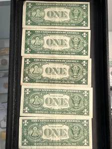lot 82 image: GROUP OF 5 US BLUE SEAL $1 SILVER CERTIFICATES
