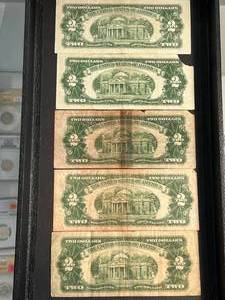 lot 86 image: GROUP OF 5 US RED SEAL $2 BILLS