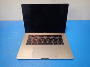 lot 38 image: Apple&nbspMacBookPro15,1 A1990 MR932LLA &nbspINTEL(R) CORE(TM) I7-8750H CPU  2.20GHZ  16GB RAM  251GB SSD  15 screen with 3360 x 2100 Resolution  Includes IOS and Charger  slight keymarks on screen