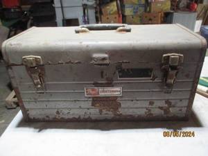 Metal toolbox containing misc chain...
