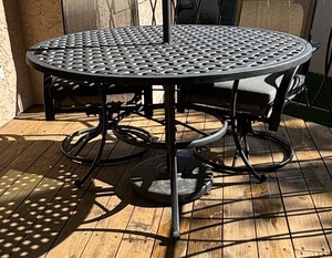 lot 12 image: Awesome Patio Table with Four Swivel Rocker Chairs and Umbrella