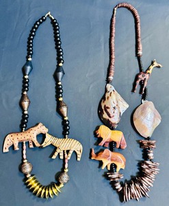 lot 114 image: Statement Pieces Beautiful Wooden  Stone African Necklace with Lions, Elephants and More