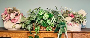 lot 103 image: Lovely Home Decor with Faux Flowers and Greens