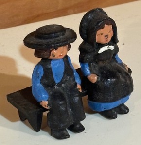 lot 441 image: Vintage John Wright Cast Iron Amish Couple on Bench Figurines