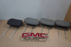 lot 249 image: Red & Chrome GMC Emblem with 4 Chrysler & Dodge Van Head Rests