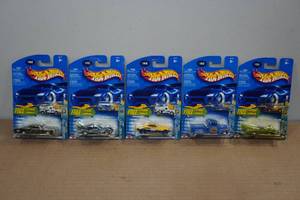 lot 282 image: 5 Hot Wheels Cars with Miniature Atomix Vehicles