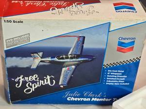 lot 22 image: 150 Scale Die-Cast Julie Clarks Chevron Mentor T-34 Trainer Plane With DVD