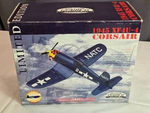 lot 24 image: 1945 XF4U-45 Corsair Die-Cast Airplane Bank with Key