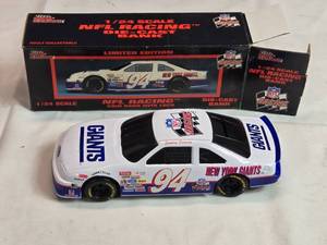 lot 74 image: Racing Champions NFL Racing New York Giants Die-Cast Coin Bank 124