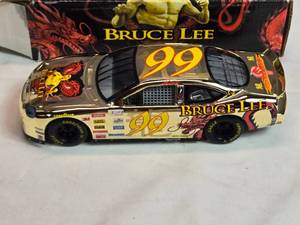 lot 81 image: Racing Champions Bruce Lee #99 Jeff Burton 124 Scale Die-Cast Ford Taurus