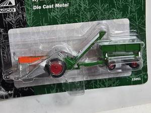 lot 91 image: Ertl Oliver 88 Tractor w Mounted Picker and Wagon Die-Cast Model