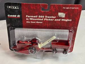 lot 93 image: Ertl Farmall 560 Tractor w Mounted Picker and Wagon Die-Cast Model