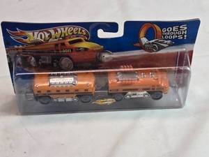 lot 97 image: Hot Wheels 2011 Orange Train Engine Die-Cast Model Rocky Mountain Rail