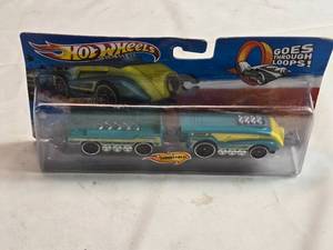 lot 101 image: Hot Wheels Green and Yellow Train Engine Die-Cast Model Super Steamliner