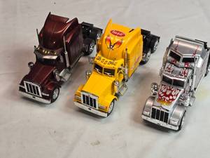 lot 102 image: Lot of 3 Toy Trucks - One has batteries, untested functions