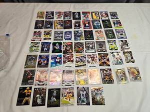 lot 212 image: Lot of 60 NFL Stars Cards Including Lamar Jackson, Stefon Diggs, Russell Wilson, Justin Fields, Brett Favre