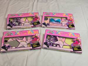 lot 228 image: Lot of 4 Movie Star Dress Up Sets
