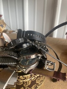 lot 30 image: bin full of watches and watch parts