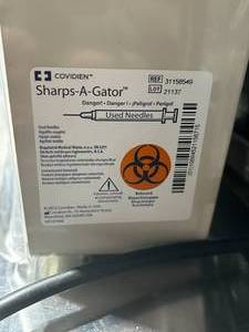 lot 22 image: Case of Covidien Sharps-A-Gator Containers Covidien 31158549 Sharps-A-Gator Wall Cabinet, Almond, for Tortuous Path Sharps Container, 5 Quart