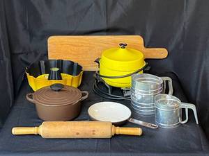 lot 142 image: Level 3 - Assorted Kitchenware Lot with Le Creuset Ductch Oven and Pan, General Electric Hotplate, Bundt Pan, and More